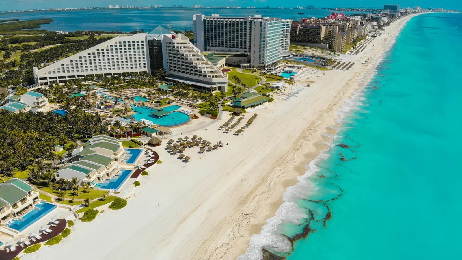 Aerial view of the turquoise Caribbean beach and hotel zone at Cancun