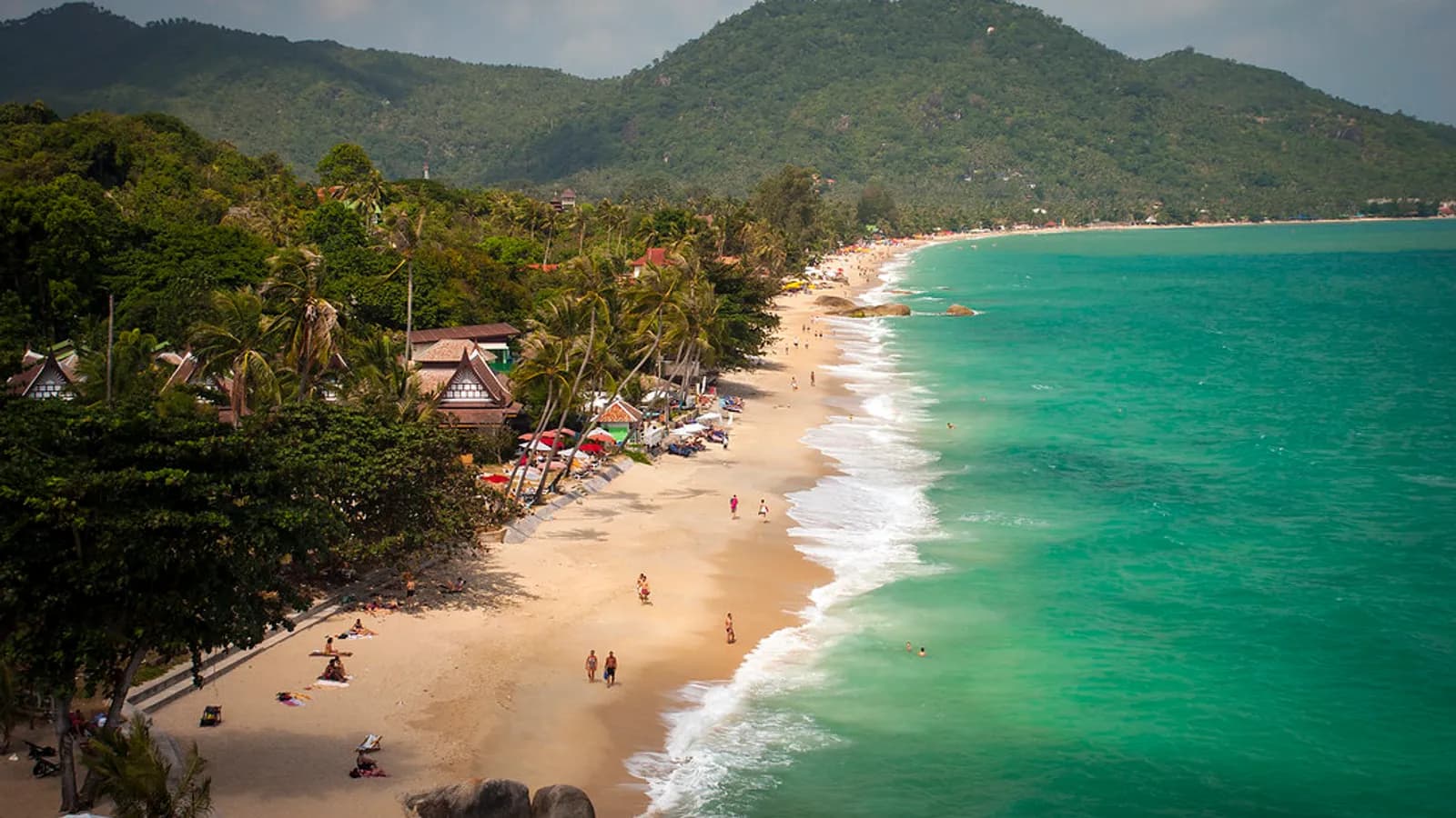 Lamai Beach, Koh Samui — turquoise Gulf water, white sand crescent, jungle-covered hills behind