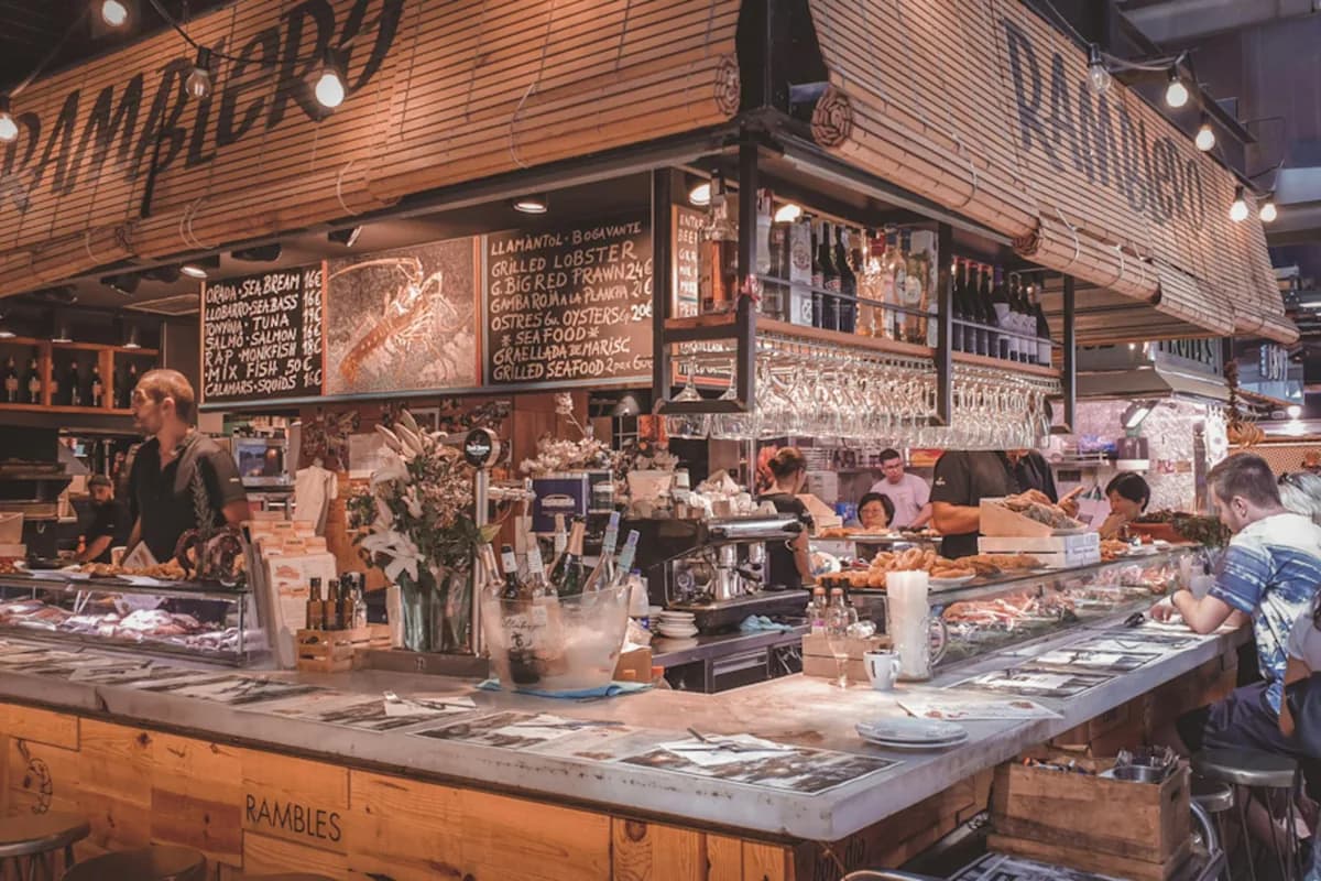 Lively market food stall in Barcelona, Spain capturing the vibrant Mediterranean culinary atmosphere.