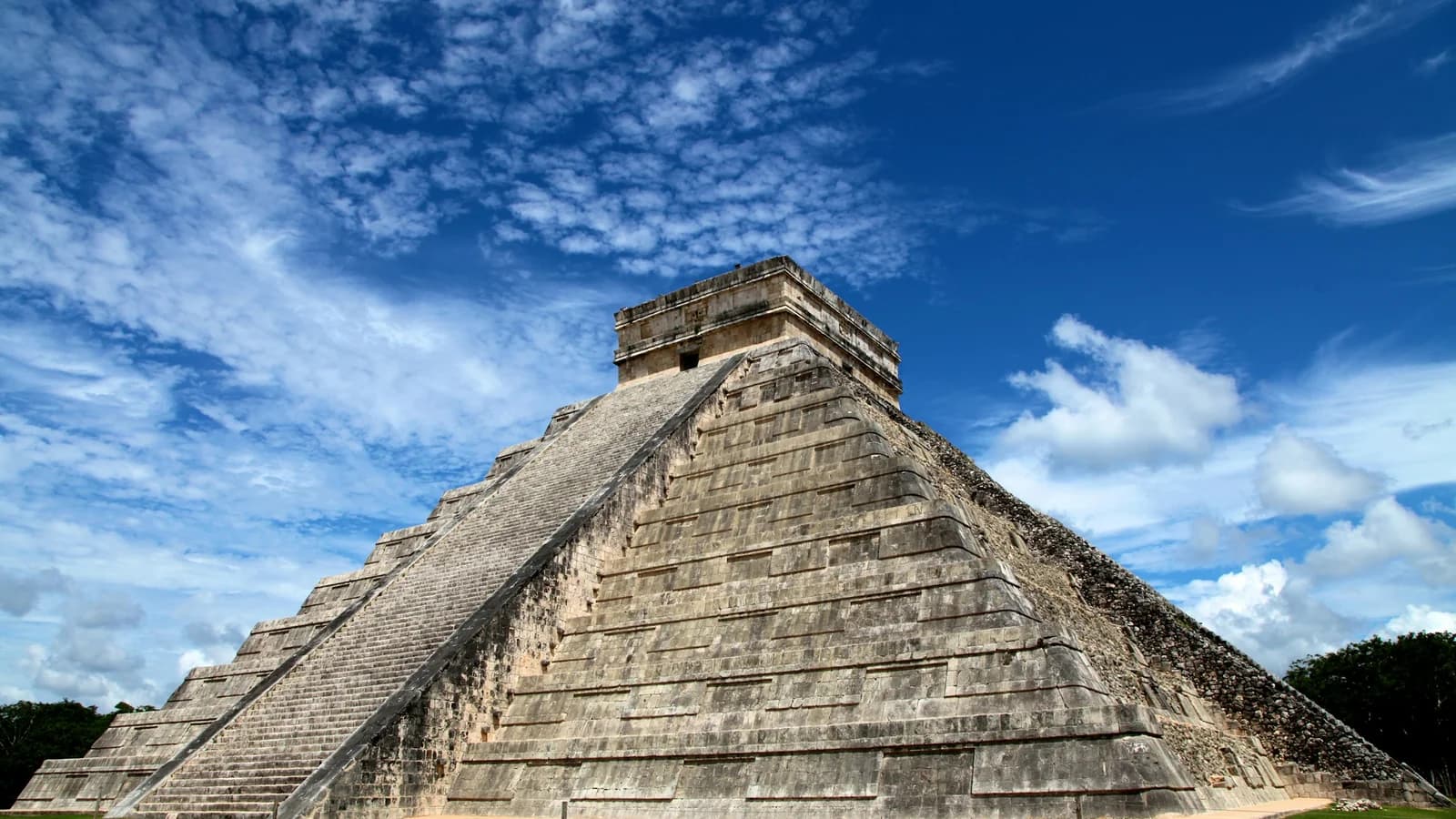 El Castillo pyramid at Chichen Itza under a clear blue sky, Mexico