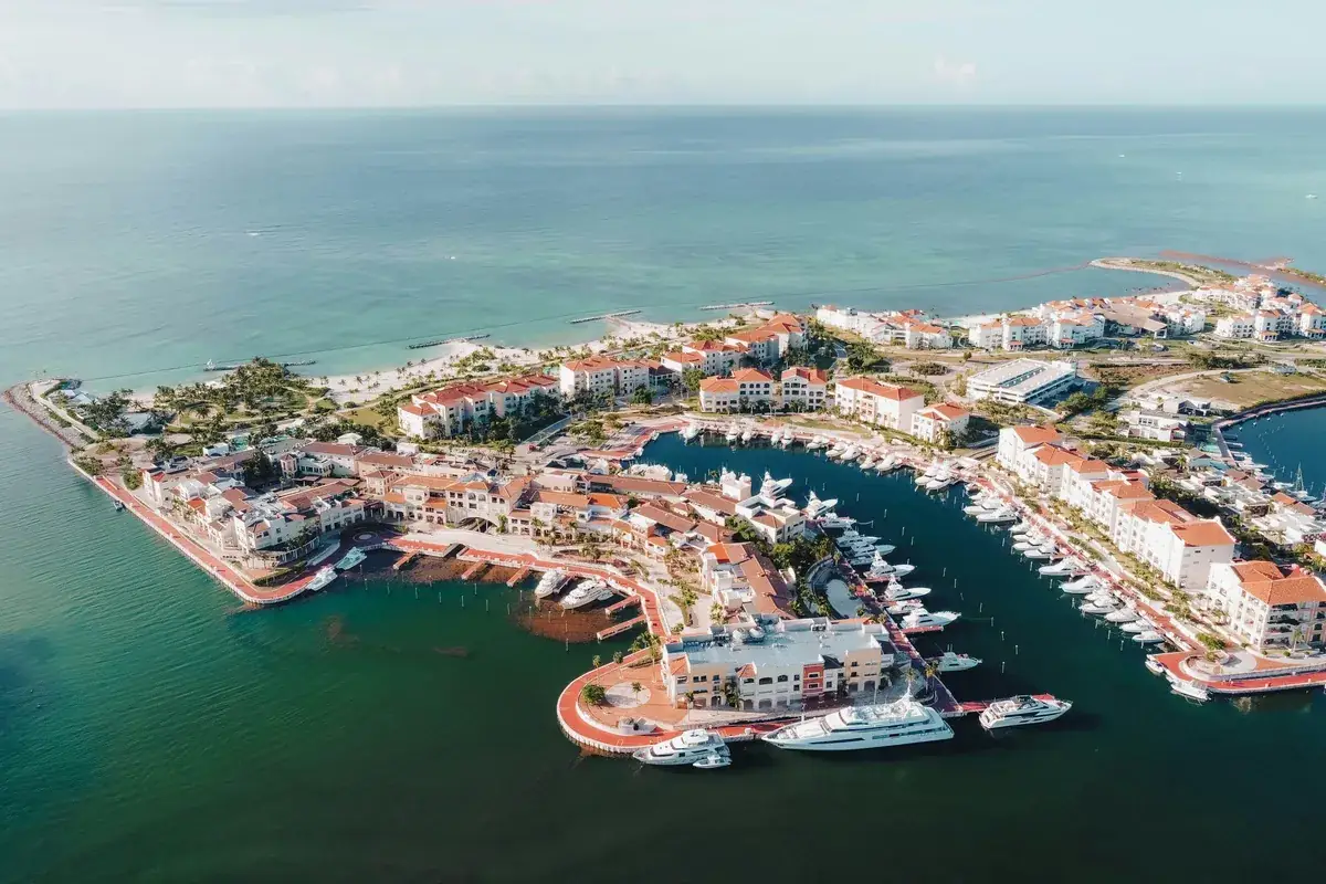 An aerial view of a marina and resort coastline in Punta Cana
